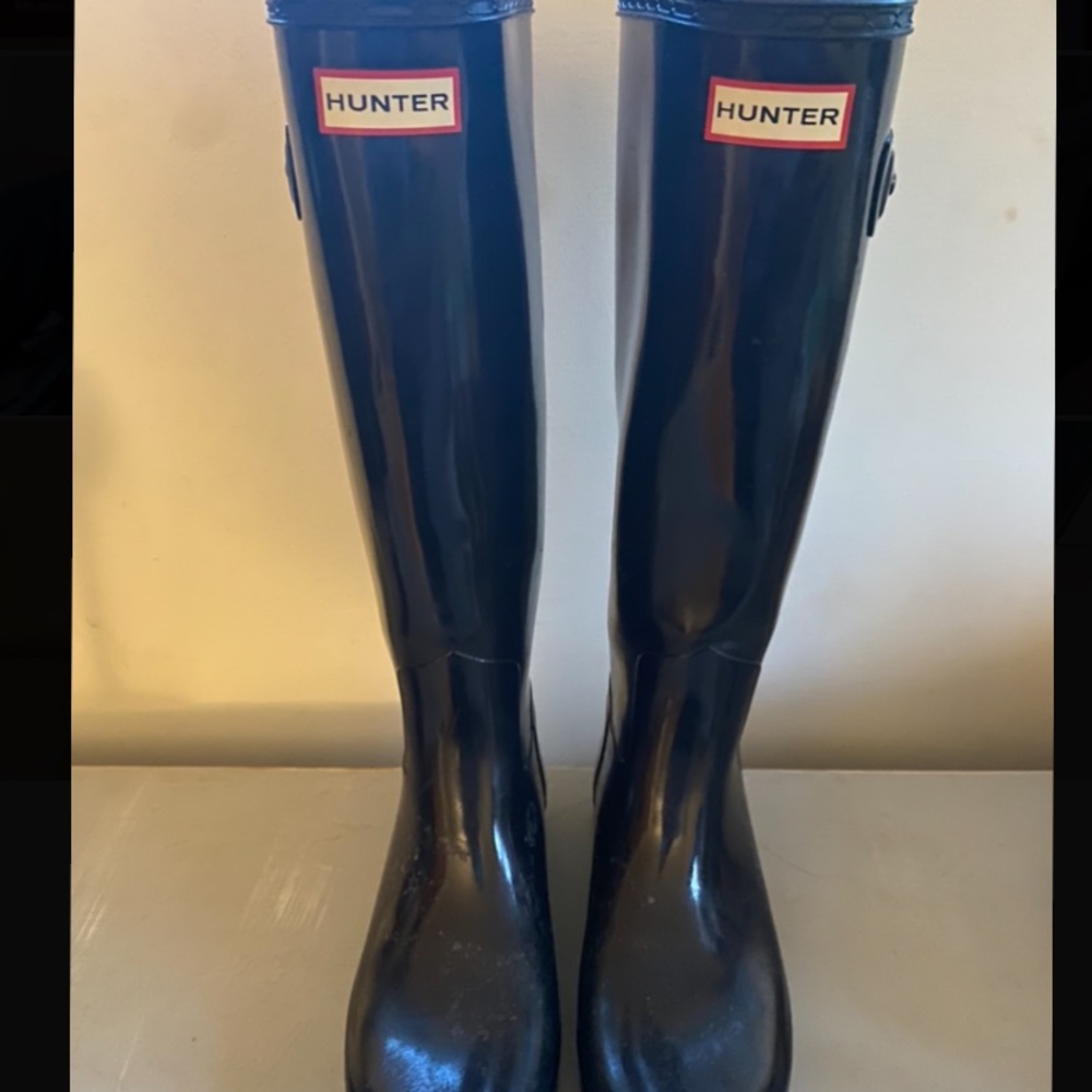 Tall black hunter boots